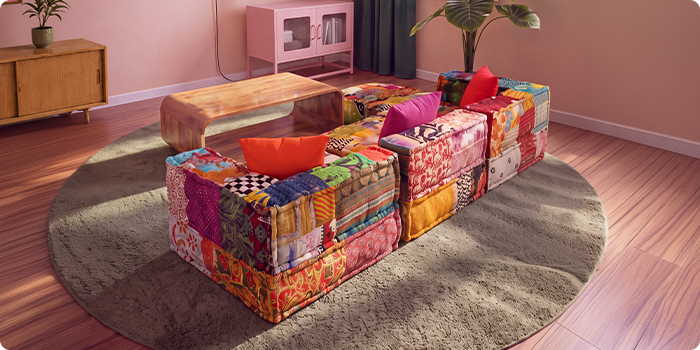 Farverig modulsofa i patchwork opstillet rundt om et sofabord i træ på et rundt tæppe i en moderne stue.