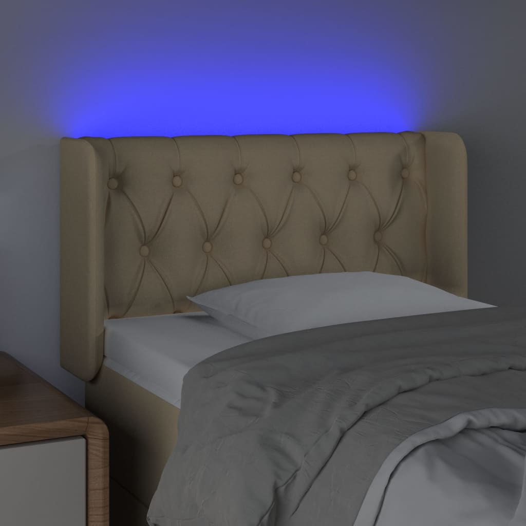 vidaXL sengegavl med LED-lys 83x16x78/88 cm stof cremefarvet